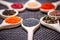 Various kind of spices on wooden spoon - detail of poppy seeds