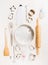 Various kitchen tools selection for easter baking on white wooden background