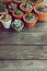 Various little succulent pot plants collection on vintage wood table with free space background