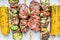 Various meat , vegetables and corn skewers on white paper, top view