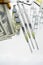 Various medications, syringes and dollar bills on a steel table