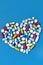 Various medicine pills arranged in heart shape vertical