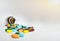 Various medicine pills, orange tablets, blue and green capsules