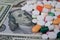 Various medicines on the US dollar. The rising cost of health care