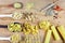 Various mix of pasta on wooden rustic background, wooden spoons, spices red pepper, bay leaf, diet and food concept, top view, set