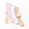 Various modern trendy women`s cotton socks set with cotton flowers and price tags on white background. Fashionable socks store.