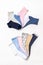 Various modern trendy women`s cotton socks set on white background. Fashionable socks store. Socks shopping, sale, merchandise,