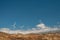 Various mountain wind turbine with blue sky