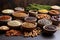 various nuts and seeds in clay bowls on a stone table