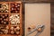 Various nuts selection: peanuts, hazelnuts, chestnuts, walnuts, pistachio and pecans in wooden box. Top view with space for your