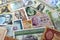 various old cash money banknotes from different countries of the world, stack of multiple currencies, pile of vintage retro bills