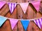 Various Patterned Triangular Flags on Wooden Planks