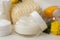 Various personal care products. Face cream, Soap, Cotton pads, washcloth, sticks and yellow flowers on a white background. spa