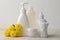 Various personal care products. Face cream, soap, washcloth, sticks and yellow flowers on a white background. spa