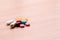 Various pills , capsule medicines and vitamin pile on wooden table