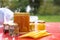 Various products such as propolis, honey wax plates against blurred background