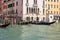 Various public and private water transport moving along the river canal in Venice city, Italy
