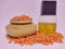 Various pulses in traditional wooden pots, red lentils and cooking oil isolated in white background