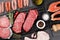 Various raw meat and fish. Steaks, sausages, salmon, chicken and spices