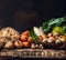 Various of raw vegetables and field mushroom on old dark wooden