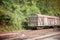 Various rusted wagons and train on the tracks