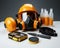 Various safety essentials arranged neatly on a white background, construction and engineering image