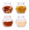 Various seasonings in glass jars isolated