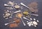 Various seeds - sesame, flax seed, sunflower seeds, pumpkin seed, chia in spoons on black background. Top view