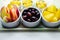 Various set fruits, pineapple, apple, grapes with matured cheddar cheese in bowls