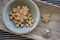 Various shapes of Christmas gingerbread cookies on light blue bowl on wooden table, group of simplicity winter sweets