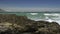 Various shots of waves breaking in front of Table Mountain