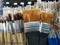 Various sizes paint brushes on shelf display in stationery shop, Art painting tool shopping concept, soft brown brushes for