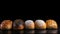 Various small fresh buns with a sprinkle of seeds in a row, black background isolate. AI generated.