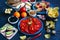 Various snacks, sandwiches, tomatoes, olives, bread on a dark table, closeup. Healthy snacks concept