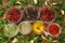 Various spices for dishes on wooden boards, camera from above