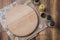 Various spices, round cutting board and cooking utensils on wooden table. Top view