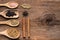 Various spices on rusty wooden background, black pepper, cinnamon stick, star anise, fennel seed