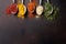 Various spices spoons on stone table