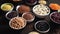 Various superfoods in smal bowls on dark rusty background