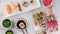 Various sushi rolls are served on a plate on a white stone background. Traditional Japanese food.