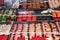 Various sushi on street market. Sushi with black and red caviar, red salmon, shrimps, mussels and Hiyashi Wakame seaweed salad