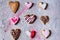 Various sweet heart shaped valentines cookies on grey surface