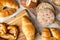 Various types of bread, buttery croissants, breads, rolls, baguettes, Fresh baked goods, flat lay