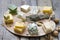 Various types of cheese on abstract vintage paint palette