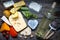 Various types of cheese with bottle of wine on old retro boards still life