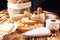 Various types of cheese on rustic wooden table. cheese platter