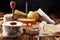 Various types of cheese on rustic wooden table. cheese platter