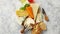 Various types of cheese served on rustic wooden board