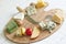 Various types of cheese on white abstract still life