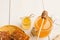 Various types of honey on white wooden background, closeup